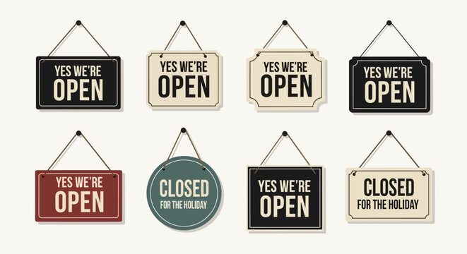 Collection of hanging open and closed signs on white background