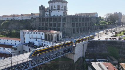 Obraz premium Dom Luis I Bridge In Porto Portugal. Traffic Is Moving Across A Modern Cable(Stayed Bridge. Metropole Landscape Company Building Vibrant. Metropole Corporate Town. Porto Portugal.