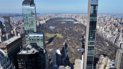 Obraz premium Central Park In Manhattan New York United States. Aerial View Of Green Space Surrounded By Lush Forest Trees. Business Sky Downtown Cityscape. Business Downtown Panorama. Manhattan New York.