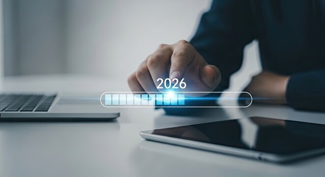 Businessman hand touching virtual screen with loading bar and 2026 year for business planning and new year concept.