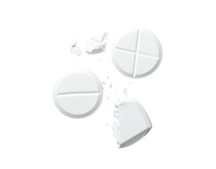 Close-up of white pills, some whole and others fragmented, on black