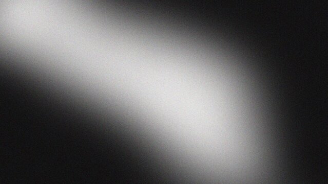 A light beam shines brightly on a dark surface creating a dramatic visual effect in a photograph from a close-up viewpoint