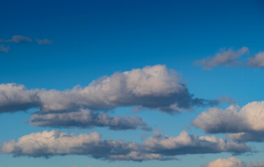 Fototapeta premium White and gray clouds in a blue sky.
