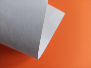 white paper on orange background
