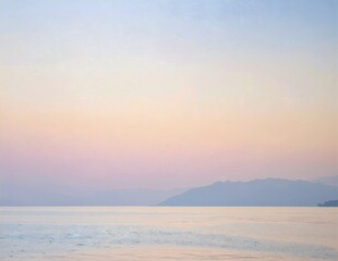Obraz premium a serene painting of the ocean with gentle waves, distant snow‑capped mountains, and a soft pastel sky in the background