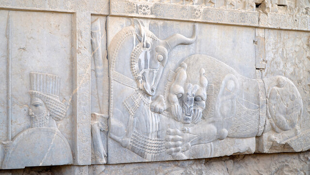 Bas-Relief of a Lion Hunting a Bull at Persepolis. Ruins of The Capital of Achaemenid Empire. Shiraz, Iran.