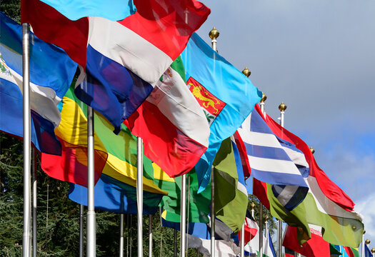 Geneva, Switzerland, Europe : Palace of Nations, national flags of the member states fluttering in the wind, European Headquarters of United Nations, United Nations Office at Geneva (UNOG)