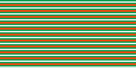 Obraz premium Christmas seamless pattern. Red and green diagonal stripes background. Candy cane repeating decoration wallpaper. Winter holiday lines backdrop. vector,eps.10