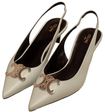 Celine Alma Triomphe low-heeled slingbacks in ivory leather with metal logo on the toe. Milan, Italy, 7 February 2026