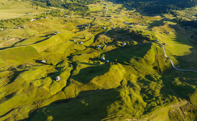 Summer aerial panorama of Seceda highlands and Dolomites mountains, Italy