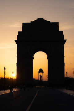 India Gate and Netaji Subhas Chandra Bose Canopy silhouette during sunrise - New Delhi, India