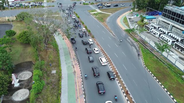 A busy highway with many vehicles indicates heavy traffic activity.