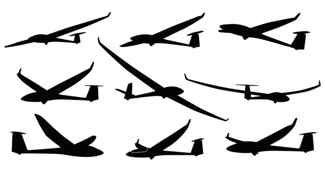 Silhouettes of various gliders in flight on white background