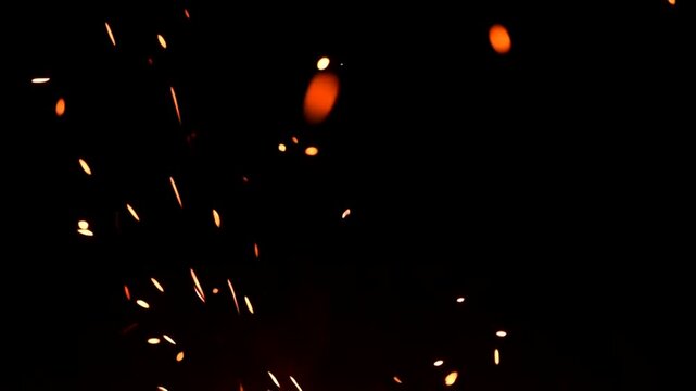 Sparks Flying in Dark Background Slow Motion.