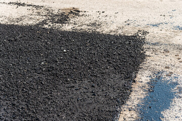 Infrastructure development close-up asphalt paving process at urban construction site
