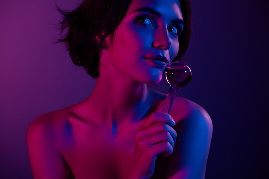 Photo of young lovely gorgeous lady advertising natural serum essence using modern cryotherapy over blue background