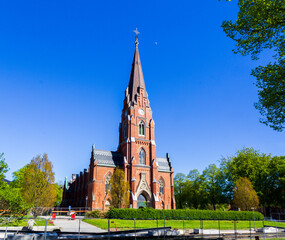 Historic Allhelgonakyrkan church in Lund, Sweden behind construction fence during tramway development project