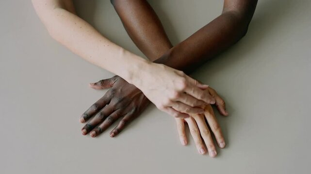 Diverse hands intertwined showing unity and support.