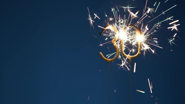 30th anniversary festive footage made with Bengal fire forming the number thirty