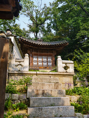 Traditional Korean pavilion and stone stairs in the lush Secret Garden of Changdeokgung Palace in Seoul