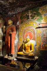 Fototapeta premium Buddha statues in the Golden Temple caves of Dambulla