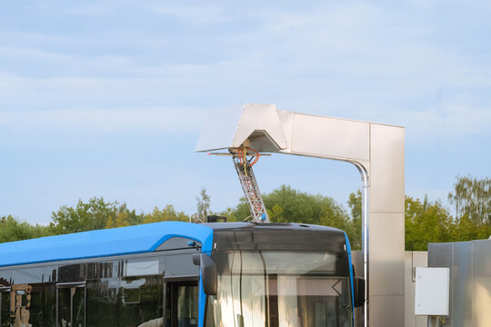 Pantograph of the electric bus at a charging station