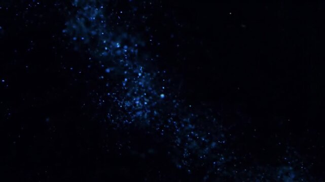 Ethereal Bioluminescent Drifters Close-up, abstract view of luminous, plankton-like particles slowly moving in deep, dark water, emitting soft, pulsing light.