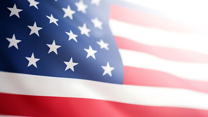 Obraz premium American flag waving in the wind with bright sunlight