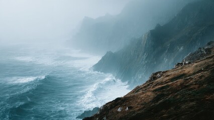 Fototapeta premium Moody coastal landscape with mountains and ocean