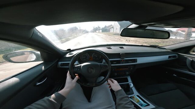 POV driving on rough road from car interior