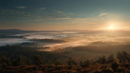 Obraz premium Sunrise over foggy valley and forest