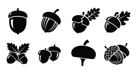 A collection of black silhouette acorns in various styles and orientations © nurjahan