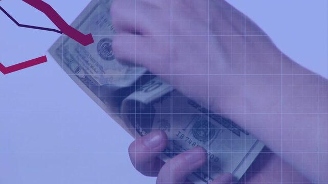 Right hand holding stack, left riffing, fanning USD bills, counting cash showing falling red charts