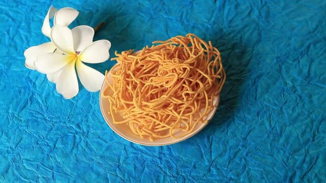 Close view of traditional Indian urad dal laddu, a round sweet prepared with butter, dry fruits, fenugreek, and aromatic spices, commonly enjoyed during festivals and cele