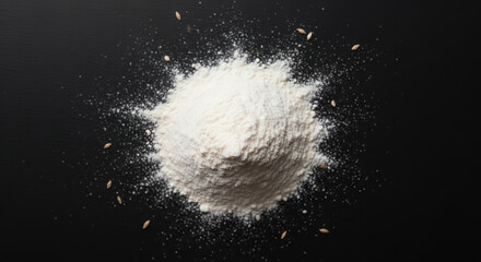 Flour dusted on black surface, minimal baking texture