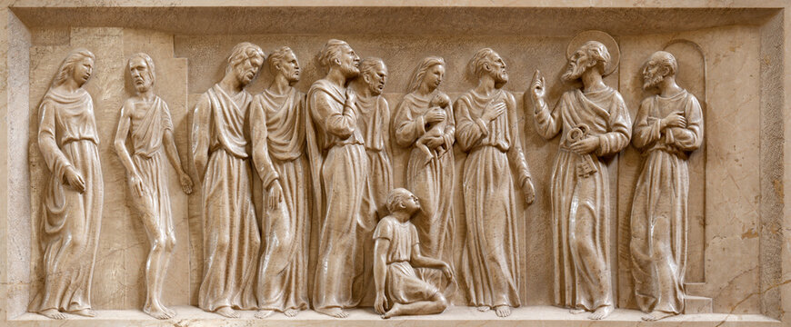 BUSTO ARSIZIO, ITALY - JANUARY 19, 2026: The marble relief of Sermon of St. Peter the Apostle in church Chiesa di San Michaele by unknown artist of 20. cent.