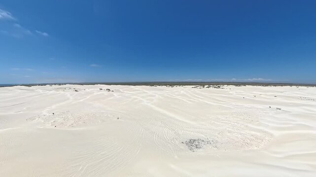 Wide Snow White Lancelin Sand Dunes Under Clear Blue Sky in the beauty of arid coastal terrain