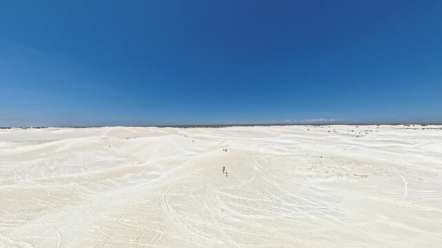 Wide Snow White Lancelin Sand Dunes Under Clear Blue Sky in the beauty of arid coastal terrain