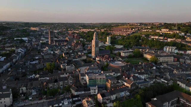 Evening glow over Cork cityscape and serene river Lee reflections