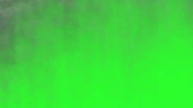 Realistic smoke and fire cloud animation on green screen background. This dynamic VFX effect creates an intense atmosphere of explosion, destruction, or dramatic cinematic scene.
