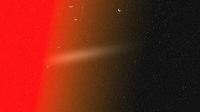 Vintage film burn texture with red light leak and dust scratches on black background
