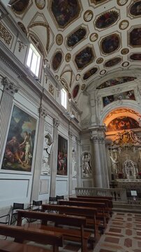 View of the Chapel of the Most Holy Sacrament in Spoleto's Cathedral, noted for its rich Baroque stucco work, a gilded altar, and painted ceiling panels