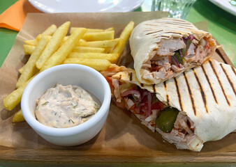 Shawarma with tartar sauce and French fries