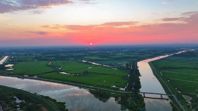 Aerial Farmland with Rivers and Green Fields at Sunset