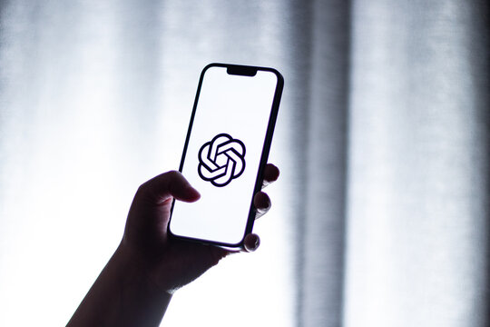 Kaliningrad, Russia - 12.11.2025. Woman holds smartphone showing Chat GPT logo on screen. AI virtual assistant app
