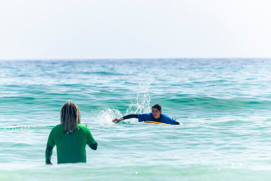 Autism inclusive surfing lesson on ocean waves