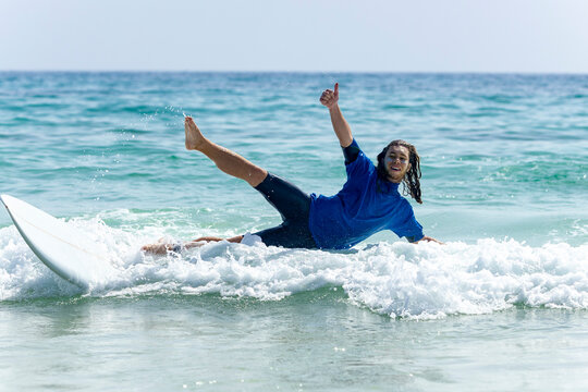 Surfer enjoying the waves with enthusiasm