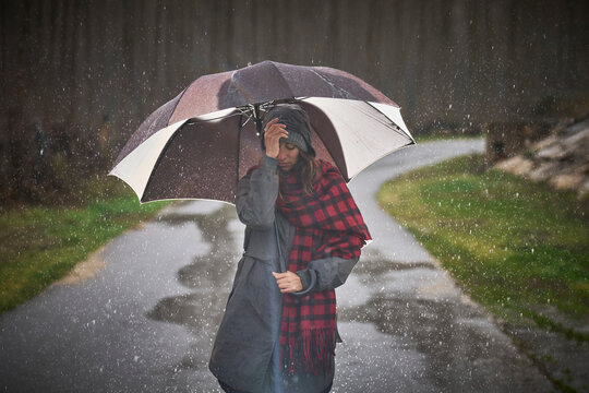 Woman with umbrella on a rainy day in the city