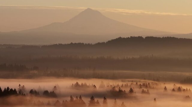 The scenic Mount Hood rises from the forested landscape of northern Oregon. This iconic Pacific Northwest mountain is part of the Cascade Mountain Range.