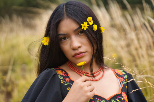 Indigenous model in traditional dress with flowers